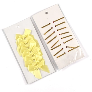 Pale yellow polyester satin bows with gold metallic twist ties on display card