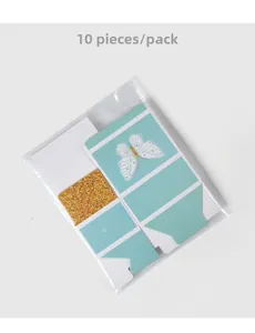 Flat pack of 10 mint blue butterfly favor boxes with gold glitter detail and clear packaging