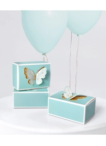 Detail of light blue gift boxes with 3D butterfly hollow design and gold glitter lining