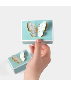 Detail of Tiffany blue wedding candy box with 3D butterfly decor and gold glitter accents