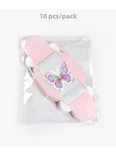 Macro-opname van 10 stuks roze 3D vlinder geschenkdoos accessoires in plastic verpakking