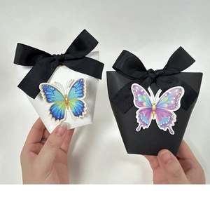 Detail of DIY 3D butterfly gift box with black ribbed ribbon and colorful gradient butterflies