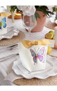 Detailed view of elegant white wedding favor box with vibrant butterfly and yellow ribbon