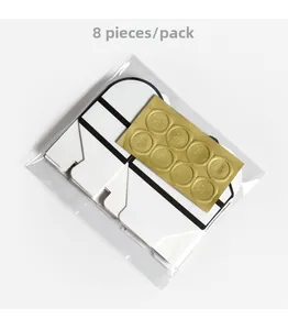 Detail of 8pcs white envelope favor boxes with gold wax seal stickers in packaging