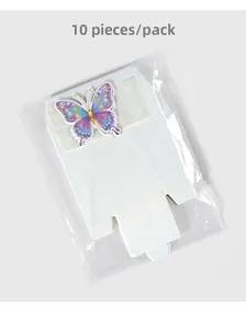 Flat-lay detail of white cardboard gift boxes with 3D colorful butterfly stickers, 10pcs pack