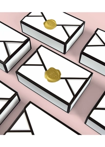 Minimalist envelope-style wedding candy boxes in white cardboard with golden wax seals