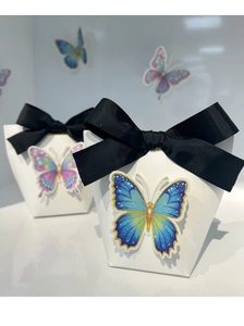Detail view of 3D paper gift box featuring black ribbon bow and 3D butterfly stickers