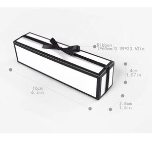 Detail view of rectangular gift box dimensions 16x3.8x4cm with black satin bow ribbon