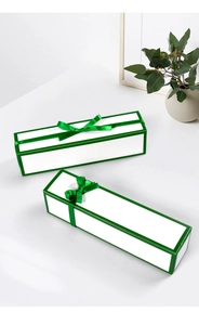 Minimalist white rectangular gift box with green trim and matching satin bow decoration