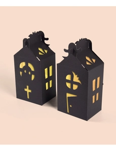 Detail of gothic house-shaped Halloween gift boxes with bat and ghost cut-outs