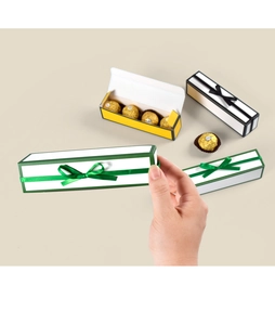 Detailed view of long chocolate gift boxes in green, yellow, and black with ribbon bows