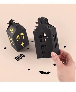 Detail of Halloween house-shaped black hollow gift boxes for candy and party favors