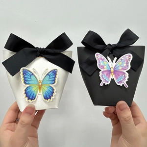 Elegant gift candy boxes in black and white with large ribbon bows and 3D butterflies