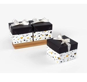 Three-piece square gift box set with black lids, white bows, and glitter heart patterns