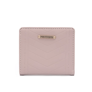 Detailed view of pale pink bi-fold wallet featuring V-quilted stitching and metal logo
