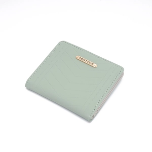 Detailed view of mint green PU leather short wallet with V-shaped quilting and gold logo