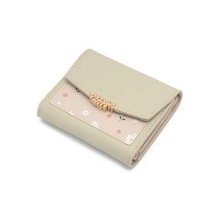 Petit portefeuille femme en similicuir vert avec imprimé floral et fermoir feuille dorée