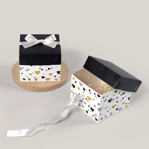 Elegant square black and white gift boxes with bow and heart pattern for birthdays