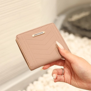 Pink quilted bifold wallet for women with gold logo and multiple card slots