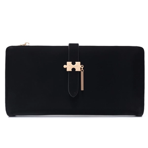 Detail of black suede texture long wallet featuring gold puzzle-shaped metal buckle clasp