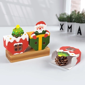 DIY foldable Christmas candy gift boxes with cutout windows and 3D holiday characters