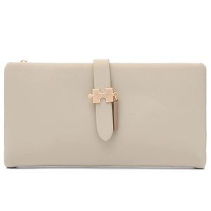 Detail view of the elegant metal puzzle closure on a beige long leather wallet for women