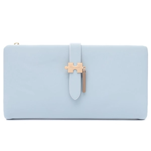 Detail of light blue PU leather long wallet with golden puzzle buckle and pendant charm