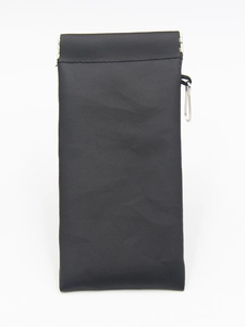 Close-up of portable leather glasses pouch with metal hook and spring closure system