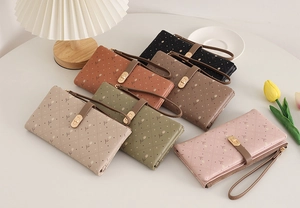 Detail of floral tulip print long wallets with metal clasp and wrist strap in six colors
