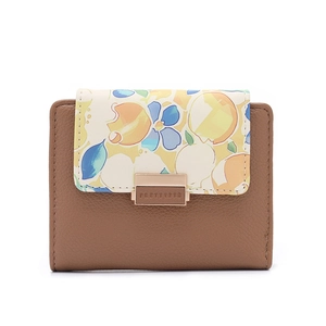 Detail of printed flap with rose gold clasp on a brown pebbled leather wallet