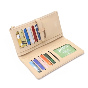 Detail of beige long wallet showing 11 card slots, zipper pocket and metal puzzle clasp