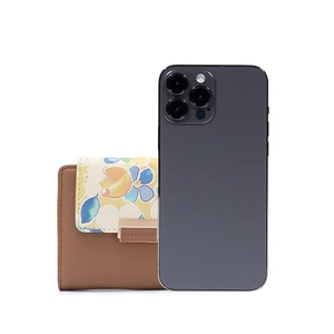 Brown leather wallet with floral print and gold clasp next to a phone for size comparison