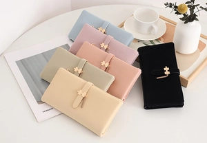 Collection of long PU leather wallets with puzzle gold buckles in various pastel colors