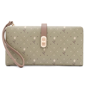 Detail of green floral long wallet with elegant tulip print and gold rotating lock