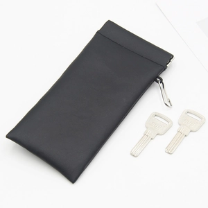 Portable black leather eyewear pouch with metal clip hook and squeeze-top closure