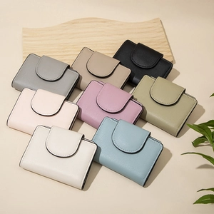 Top view of eight colorful PU leather wallets with litchi texture and minimalist flap