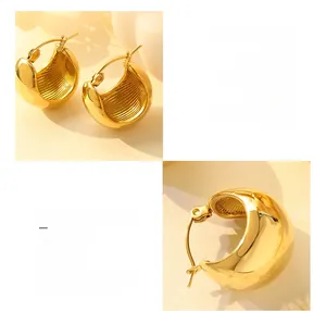 Detailed view of 18K gold plated titanium steel C-shaped earrings with striped texture