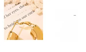 Detailed close-up of U-shaped gold plated titanium steel hoop earring with clasp design