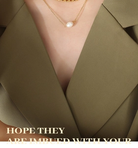 Close-up of golden pearl necklace worn with an elegant olive green textured blazer