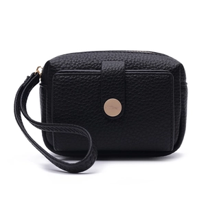 Close-up of black litchi grain leather coin purse with golden logo buckle and wrist strap