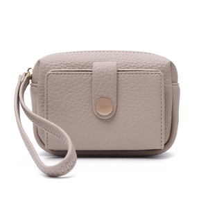 Detail showing taupe lychee pattern leather wallet with snap closure and wrist strap