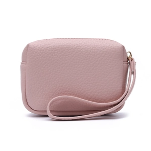 Detail of pink lychee texture leather coin purse with zipper and convenient wrist strap