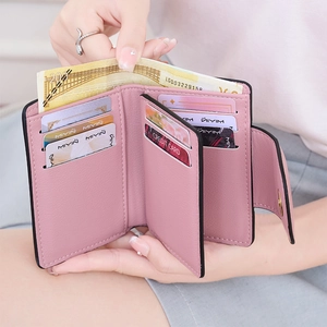 Pink PU leather tri-fold wallet detail showing 7 card slots and cash compartment