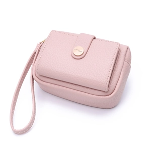 Close-up of pink litchi grain leather coin purse with golden clasp and wrist strap