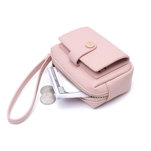 Pink PU leather coin purse with wrist strap and gold buckle on a clean white background