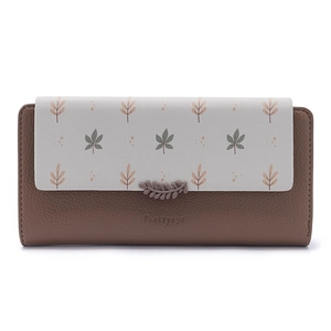 Close-up of long floral wallet with brown lychee texture and leaf magnetic clasp