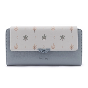 Close-up of floral pattern flap and leather texture on a blue long wallet for women