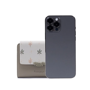 Compact tri-fold wallet size comparison with a smartphone showing its portable dimensions