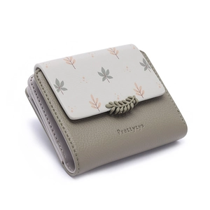 Short bi-fold women's faux leather wallet with floral print and leaf clasp detail