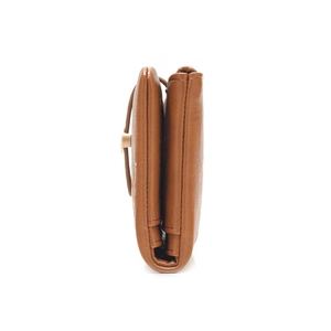 Detail view of brown leather wallet showing thickness, side stitching and gold metal buckle